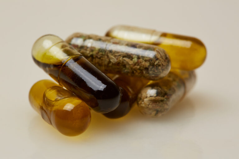 Closeup of various cannabis capsules filled with different infused ingredients.