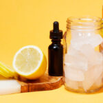 Cannabis cocktail ingredients on yellow background.