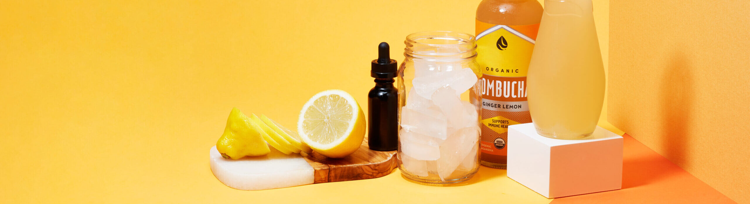 Cannabis cocktail ingredients on yellow background.
