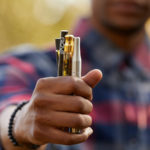 Man holding vape pens