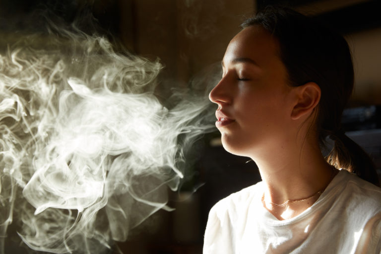Click to see a larger version of the image woman smoking weed