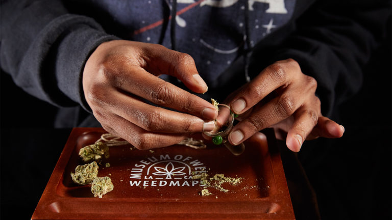 Click to see a larger version of the image packing weed into bowl