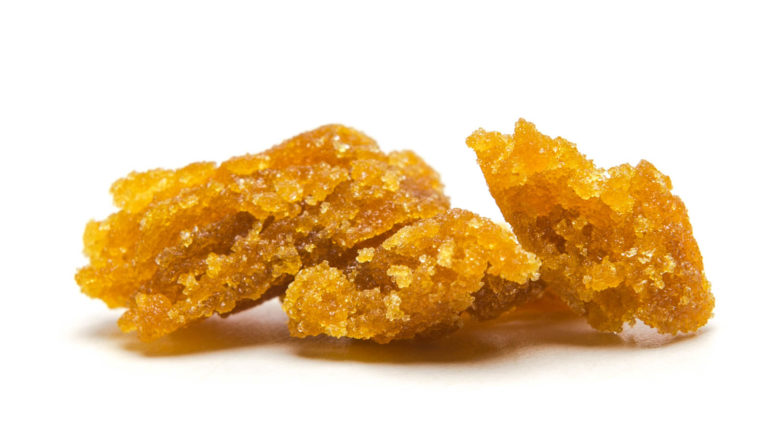 Click to see a larger version of the image Globs of live cannabis resin on white background.