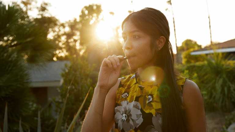 female vaping in yard