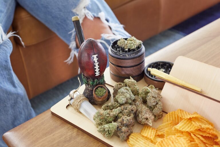 cannabis in football pipe with grinder
