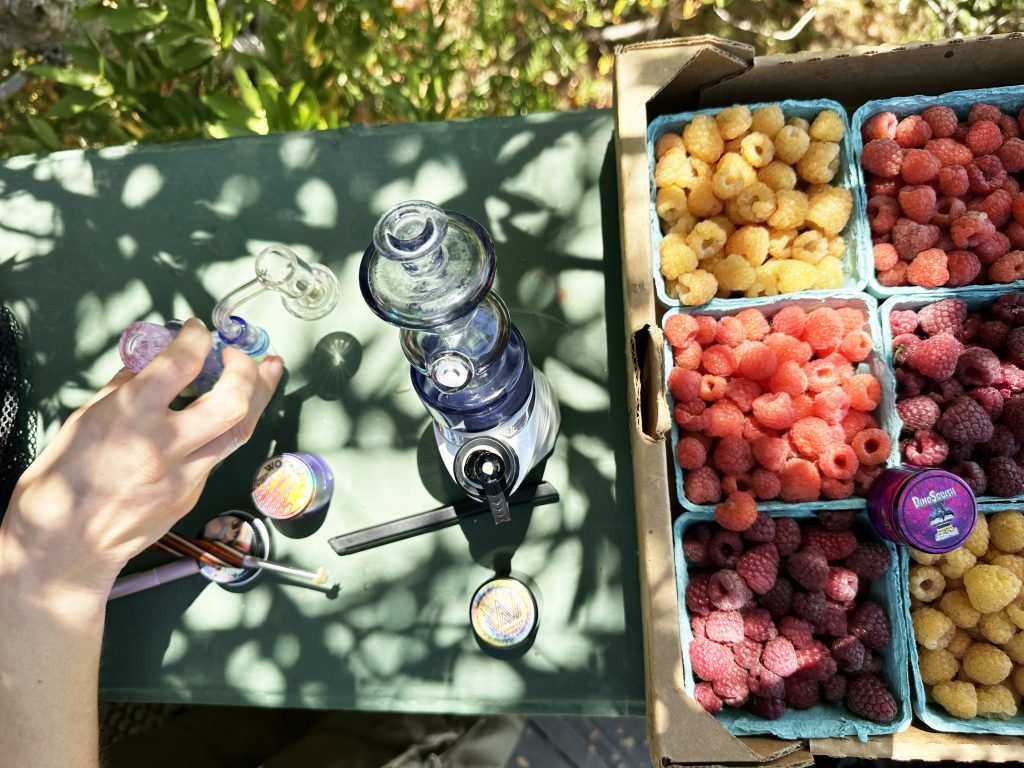 Hash set-up next to a carton of various berries