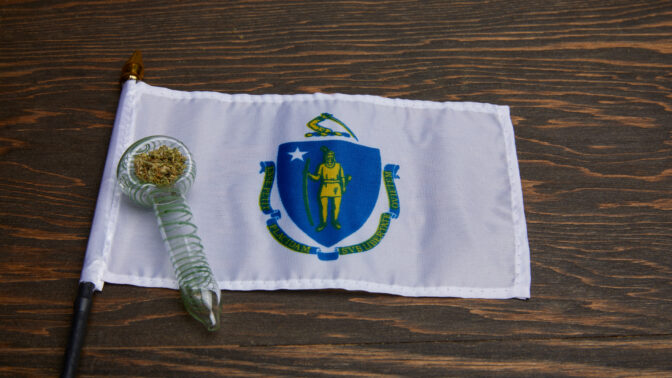 Massachusetts state flag with weed in a glass bowl