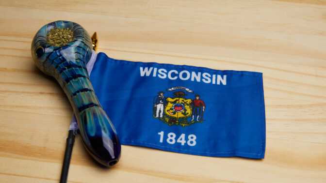 state flag of wisconsin with a cannabis-packed bowl